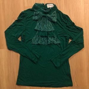 Green ruffle turtleneck